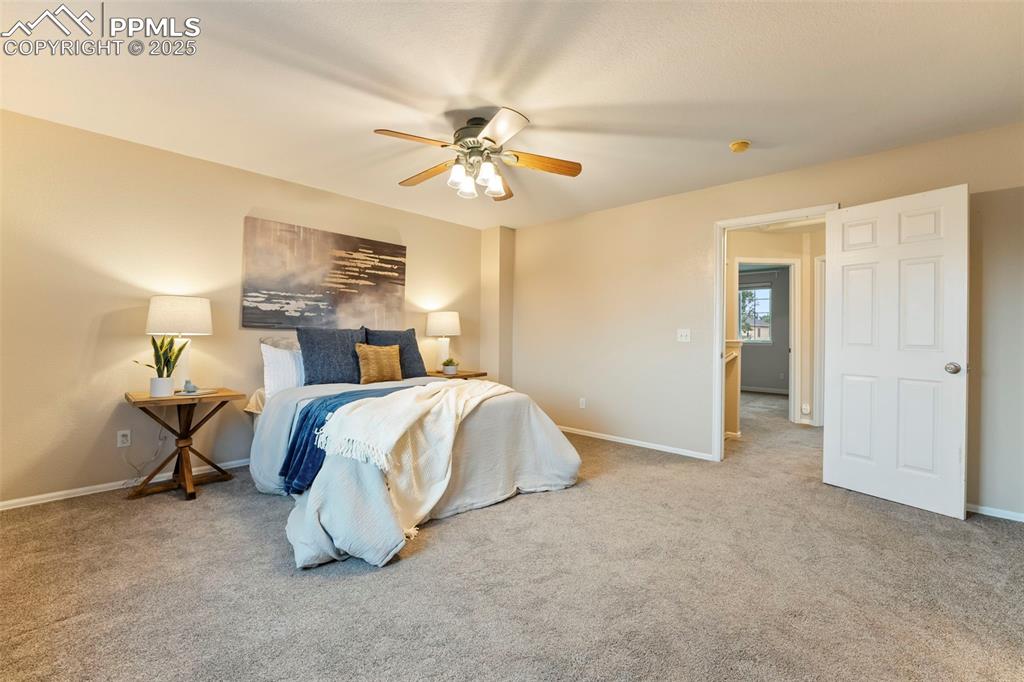 Image 13 of 31: Bedroom featuring carpet and a ceiling fan