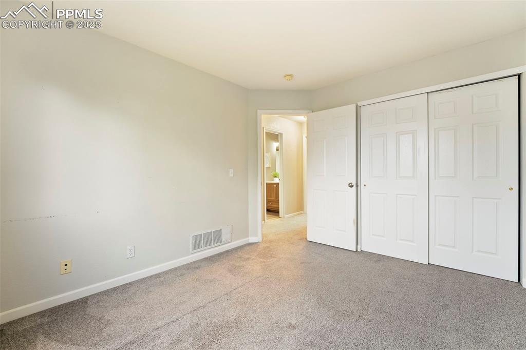 Image 16 of 31: Unfurnished bedroom featuring carpet floors and a closet