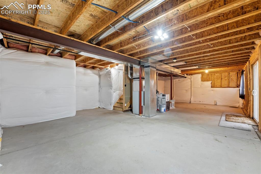 Image 20 of 31: Unfinished basement featuring heating unit