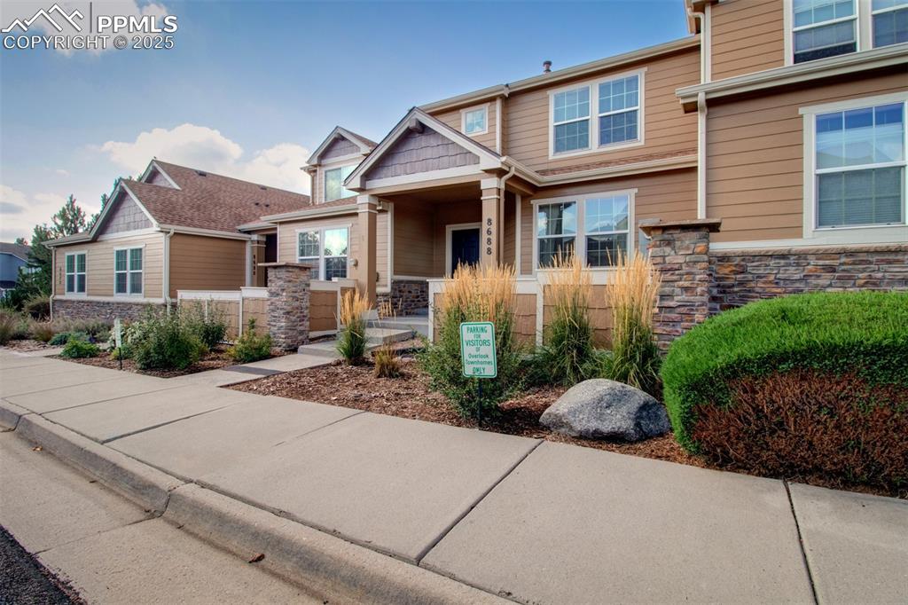 Image 21 of 24: Craftsman-style house featuring stone siding