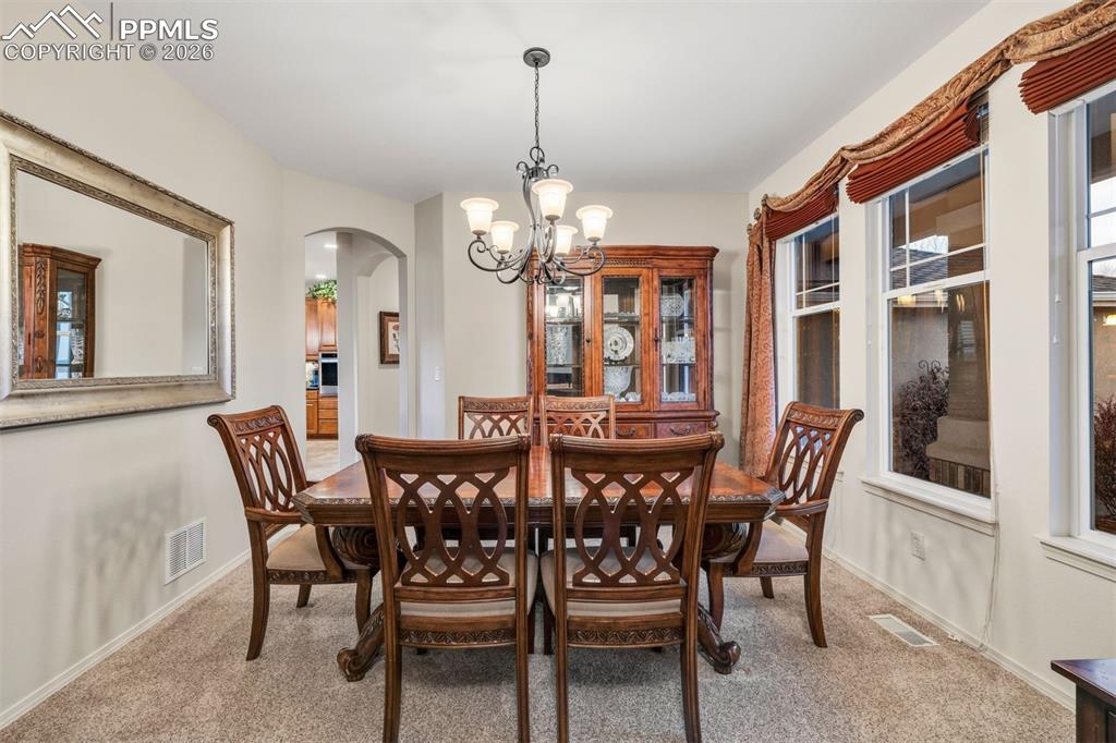 Image 16 of 50: Formal dining room accomodates a large table for holiday gatherings 