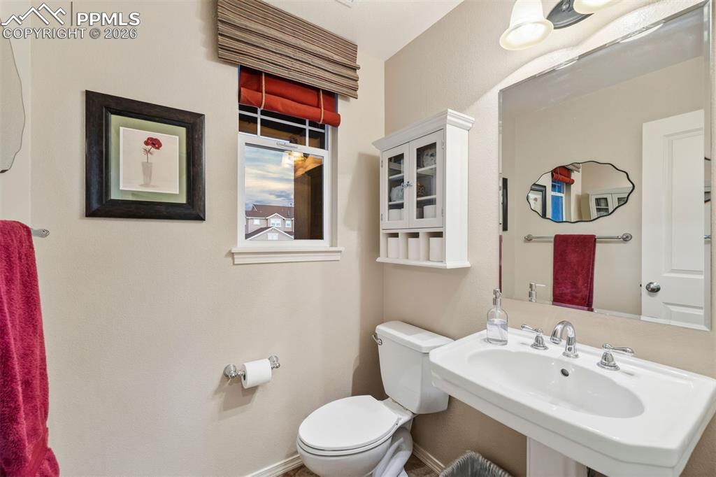 Image 19 of 50: The main level powsder room 