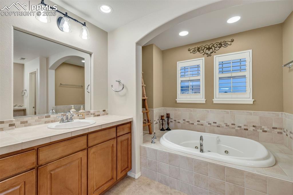 Image 24 of 50: double vanities and a large soaking tub 