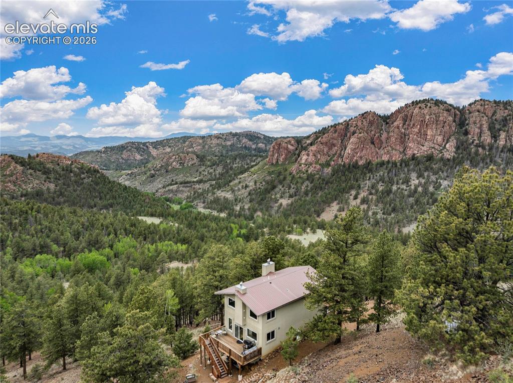 Image 1 of 31: Nestled into the mountains