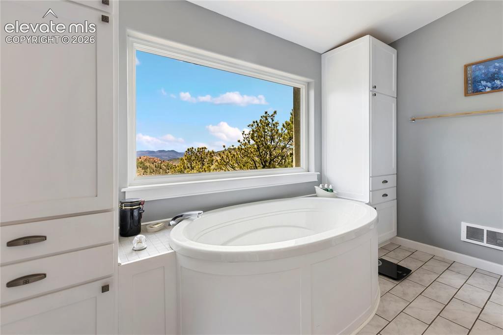 Image 20 of 31: And of course, the soaking tub with a VIEW!