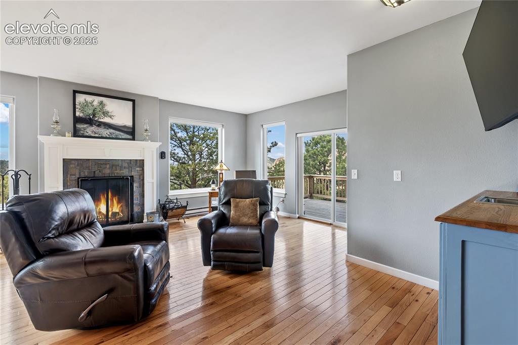 Image 5 of 31: Love the beautiful wood burning fireplace!