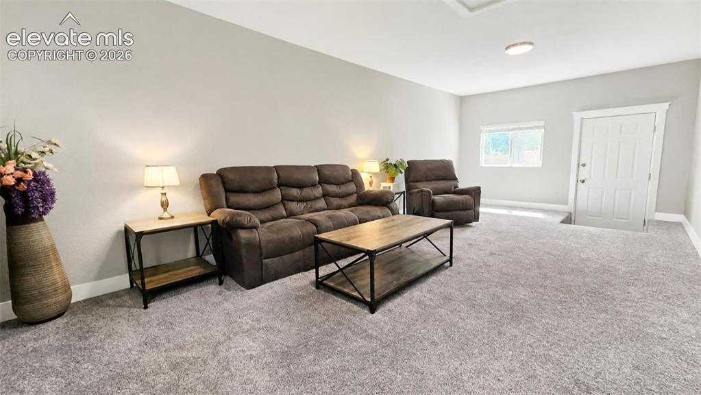 Image 12 of 31: Light gray wall finishes and coordinating carpeting