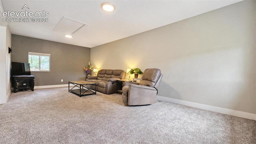 Image 15 of 31: Recessed ceiling lighting, window with white trim, wall-mounted light fixtu
