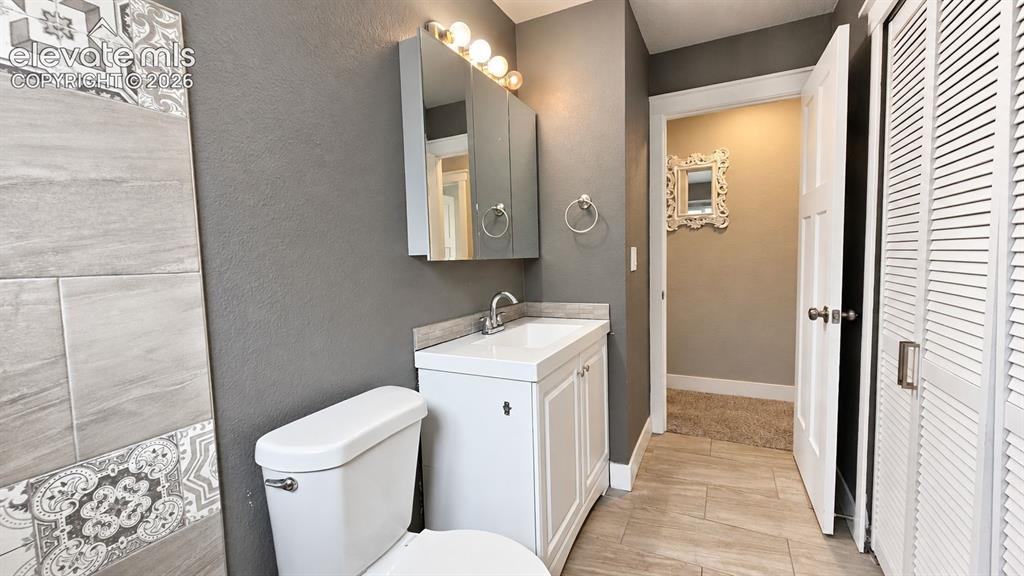 Image 19 of 31: Bathtub with surrounding tile, single window, upgraded sink, chrome-finish