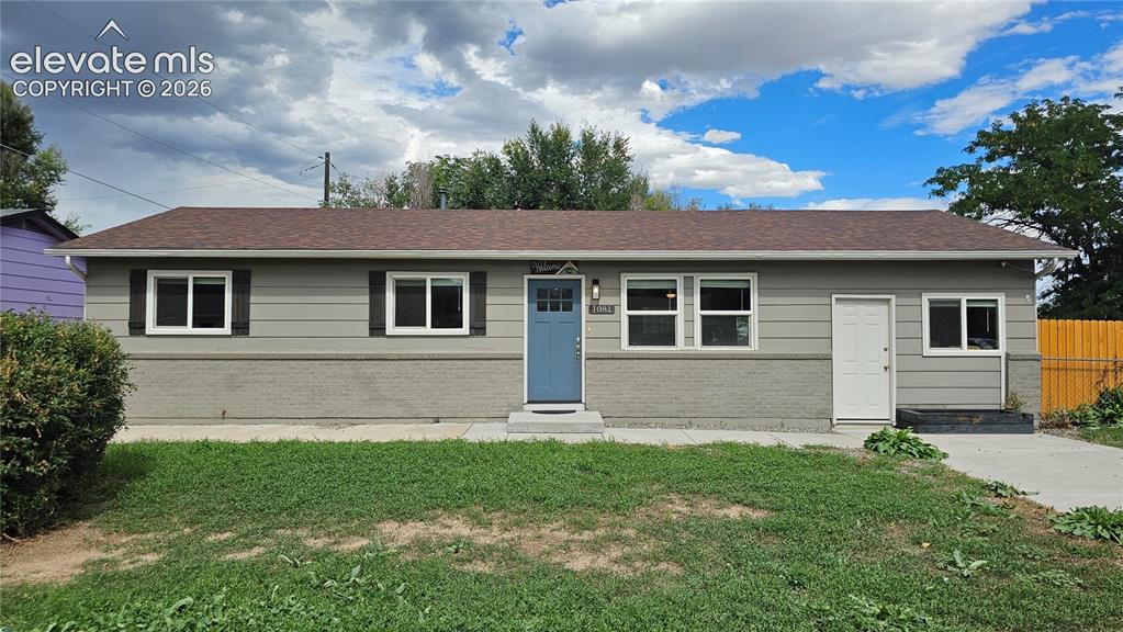 Image 29 of 31: Single-story residence featuring horizontal siding and brick siding
