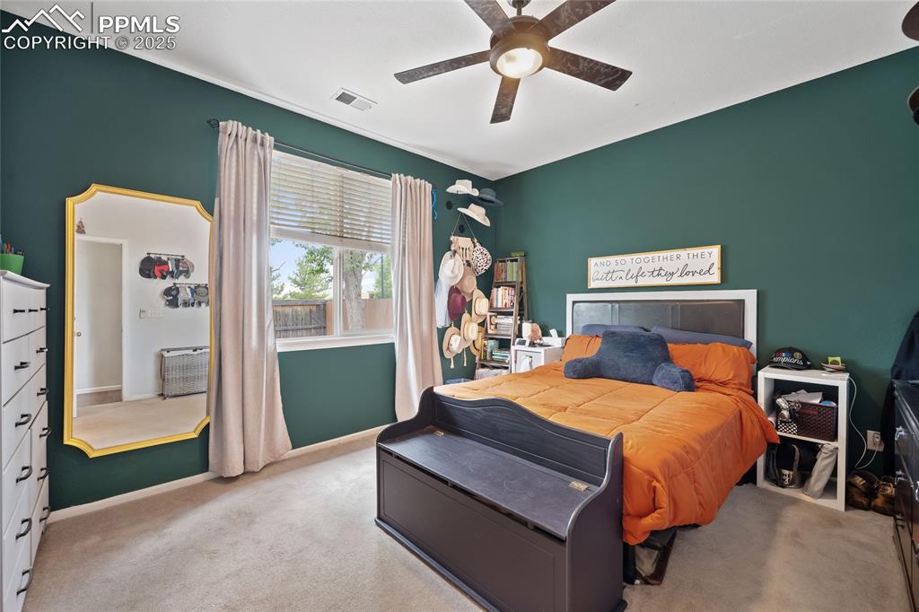 Image 16 of 44: Carpeted bedroom featuring baseboards and a ceiling fan