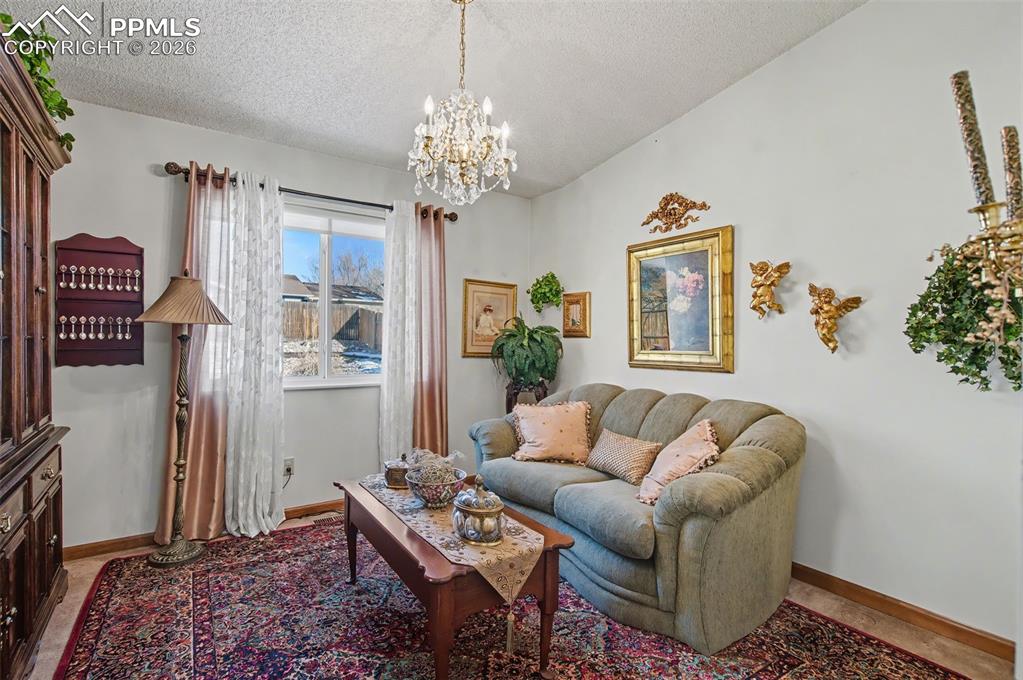 Image 14 of 48: Could be formal dining but used as a sitting room