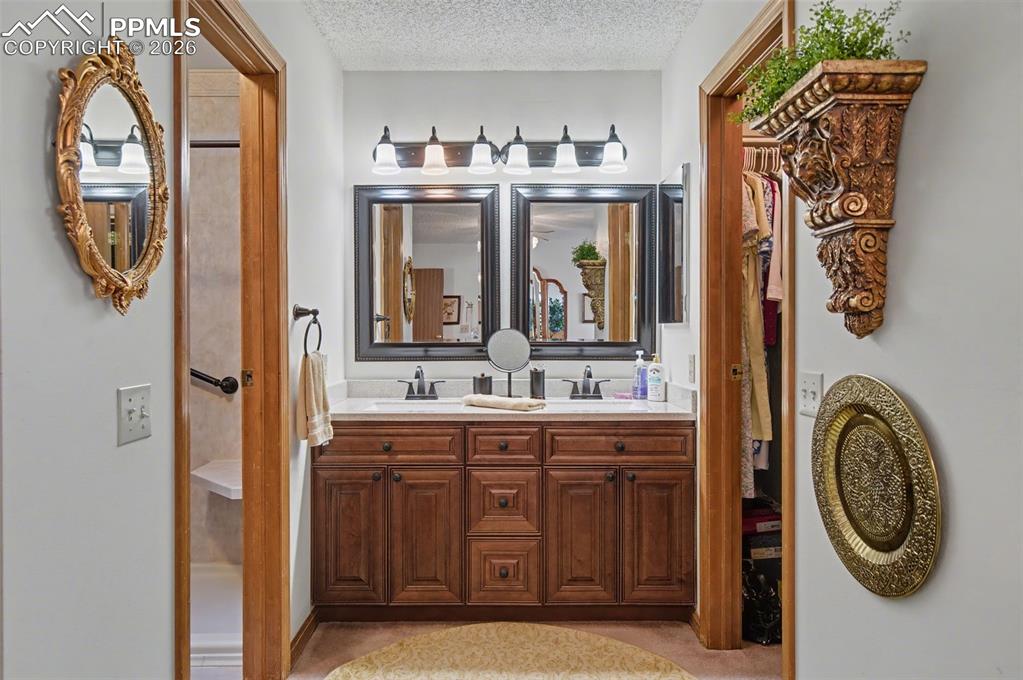 Image 19 of 48: primary main level bedroom bathroom