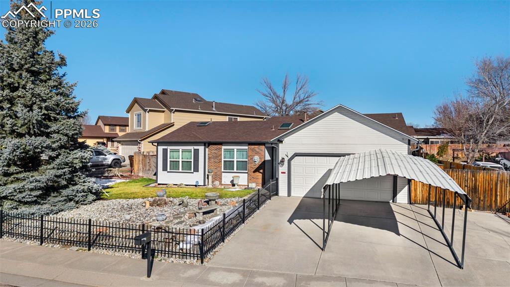 Image 2 of 48: Use the carport or easy to remove. Also additional parking next to it