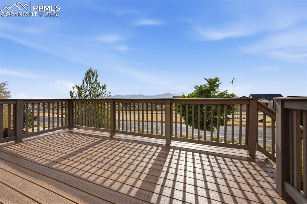 Image 17 of 49: 2023 Trex deck with mountain views