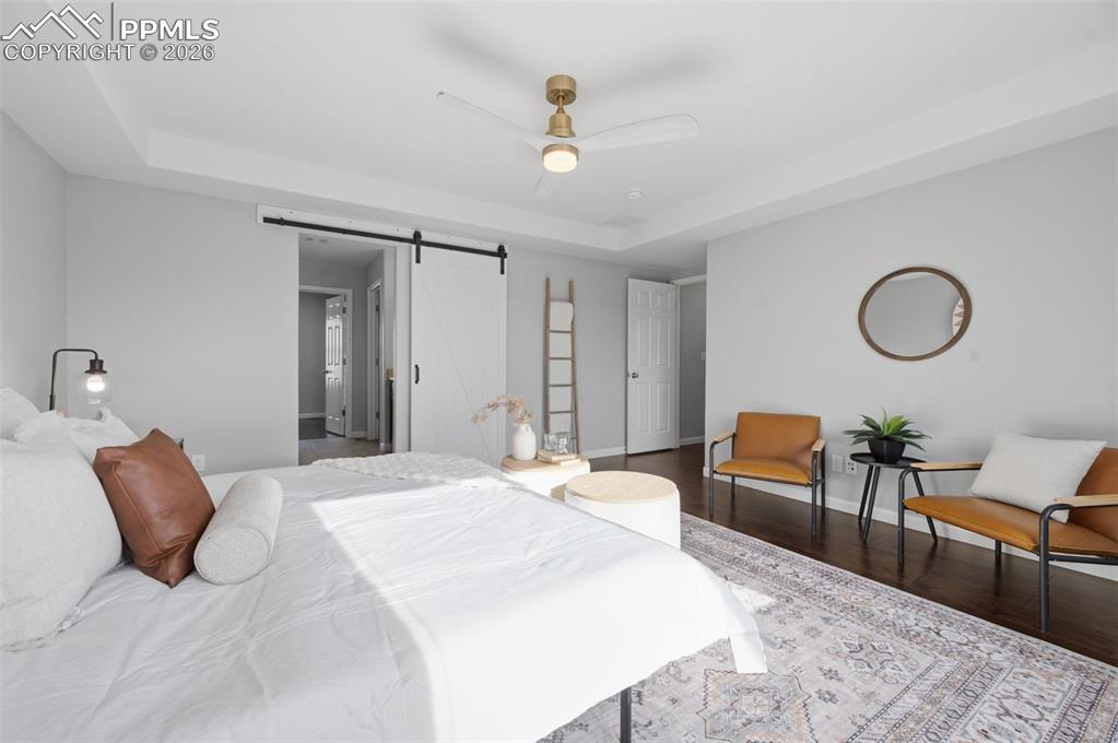 Image 21 of 49: Recessed ceiling with a modern ceiling fan featuring a brass-tone base