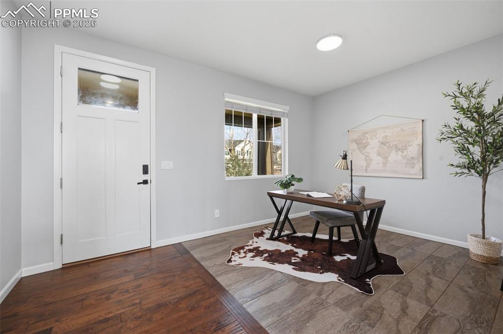 Image 4 of 49: Entryway with a solid white door featuring a clear glass pane, dark hardwar
