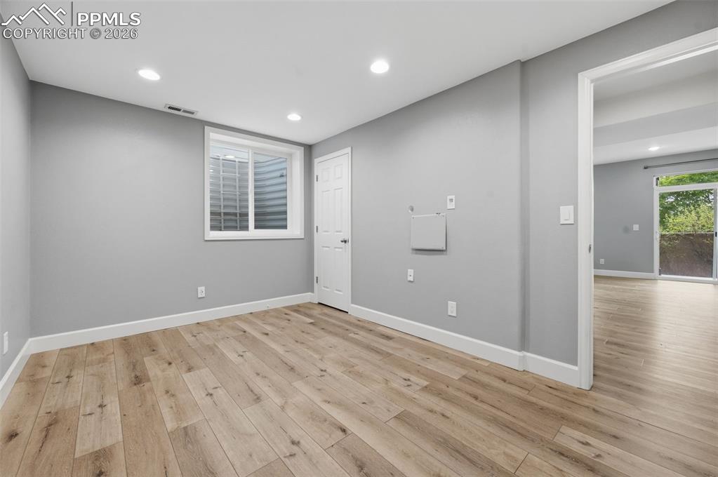 Image 41 of 49: Bonus Room. Non-conforming bedroom, weight room, etc. featuring wood-finish