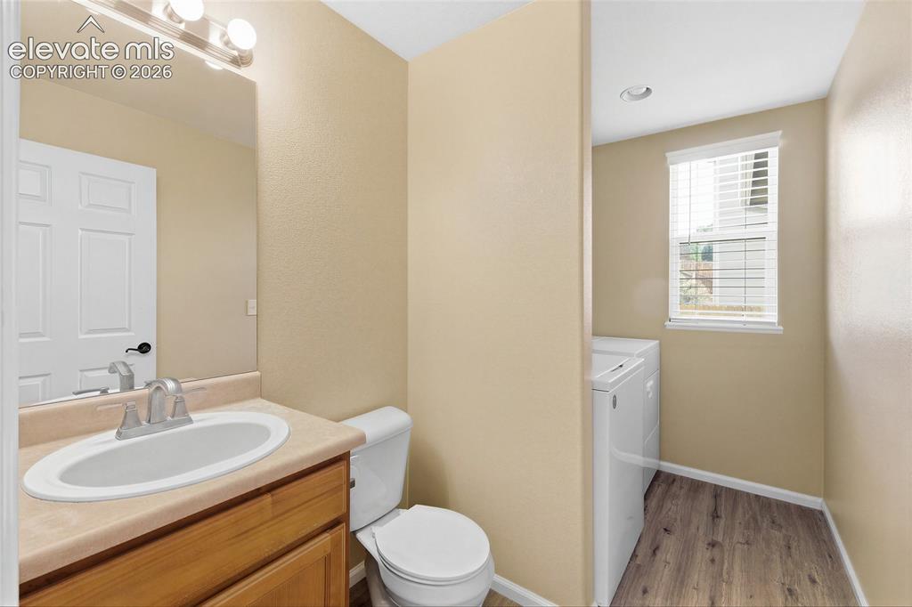 Image 19 of 39: Main level powder and laundry