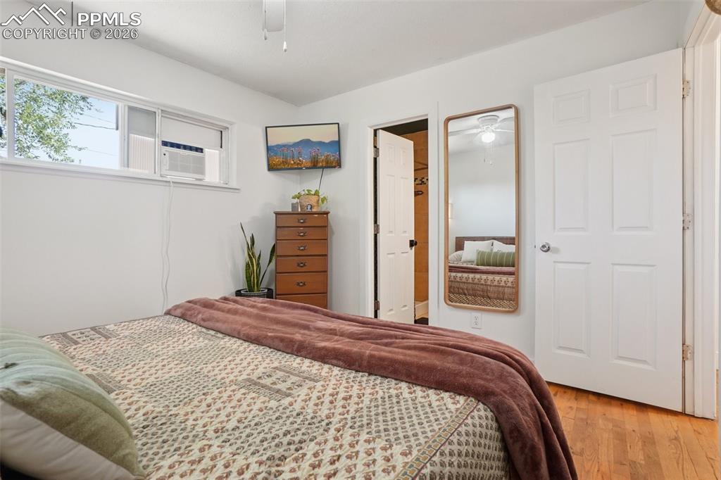 Image 12 of 38: Primary bedroom with en suite bathroom