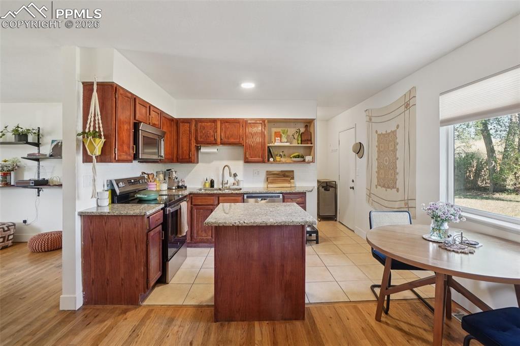 Image 23 of 38: Kitchen with walk out to backyard