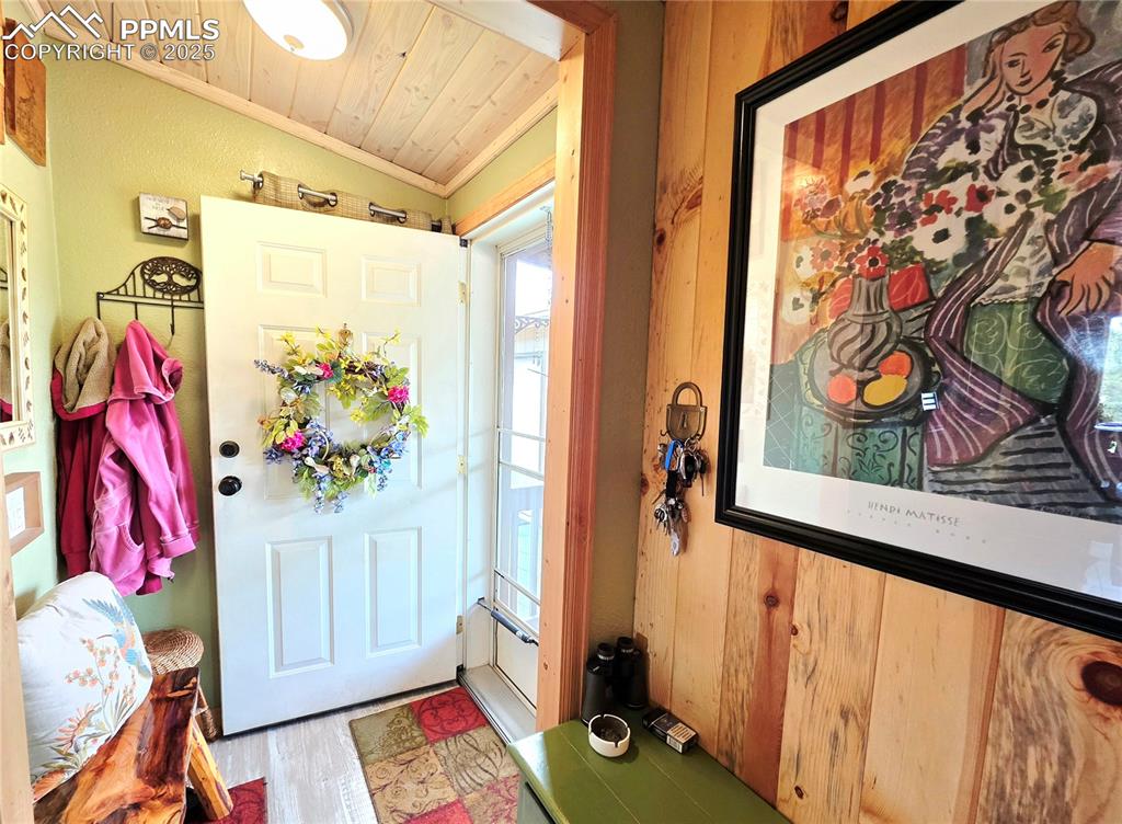 Image 10 of 50: Nice coat closet is located behind the front door