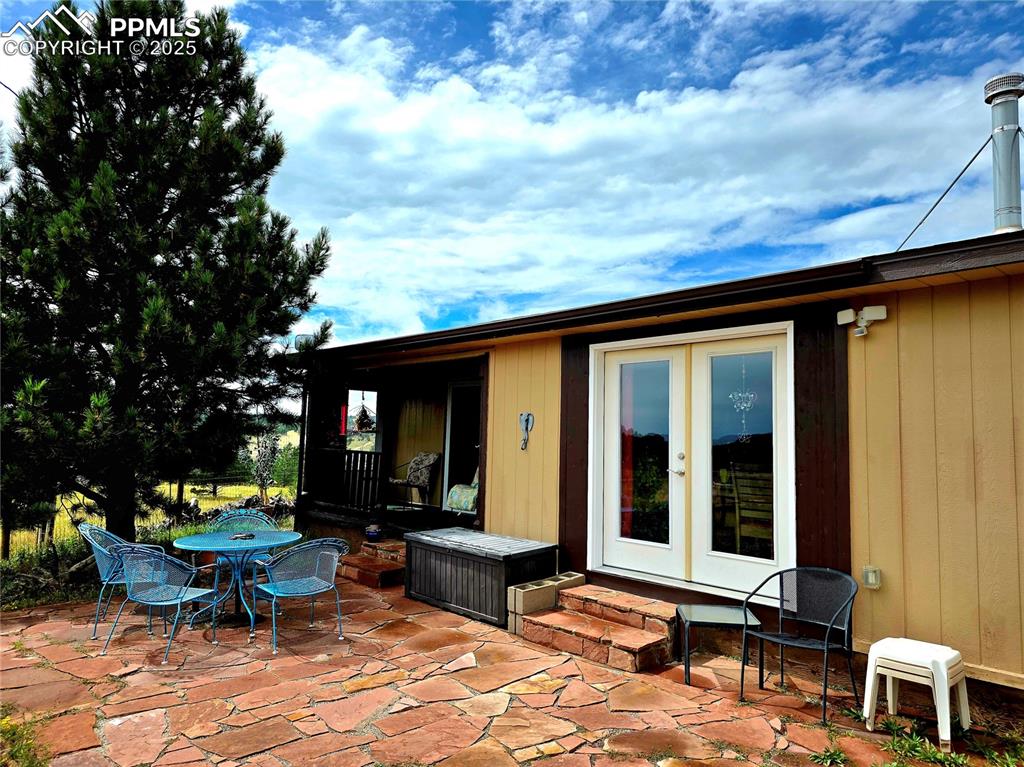 Image 35 of 50: Back yard with new french doors for access