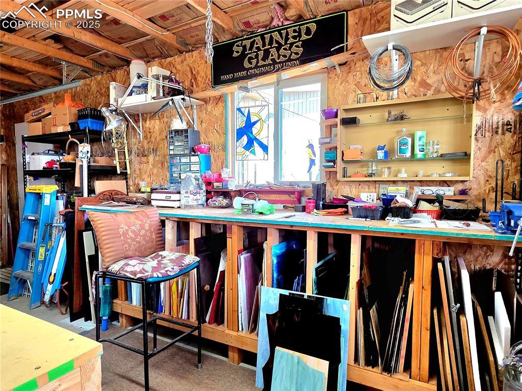 Image 43 of 50: Seller has a strained glass workshop here in the spacious 3 car garage