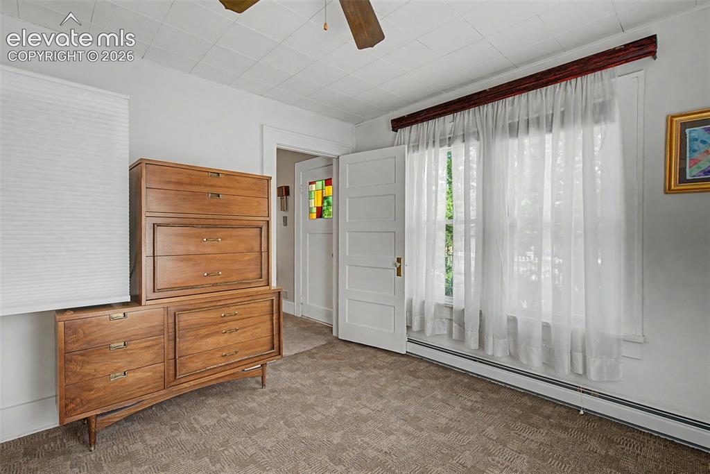 Image 10 of 26: Reverse view of bedroom to living room