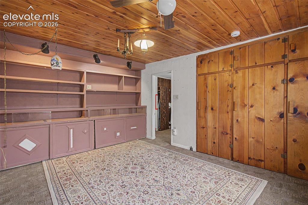 Image 17 of 26: Opposite view of bedroom.  Built-in storage