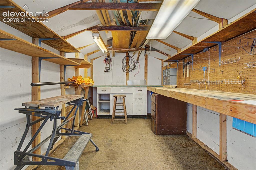Image 22 of 26: Interior of site built shop.  Lots of counter space, electric, 8x12 buildin