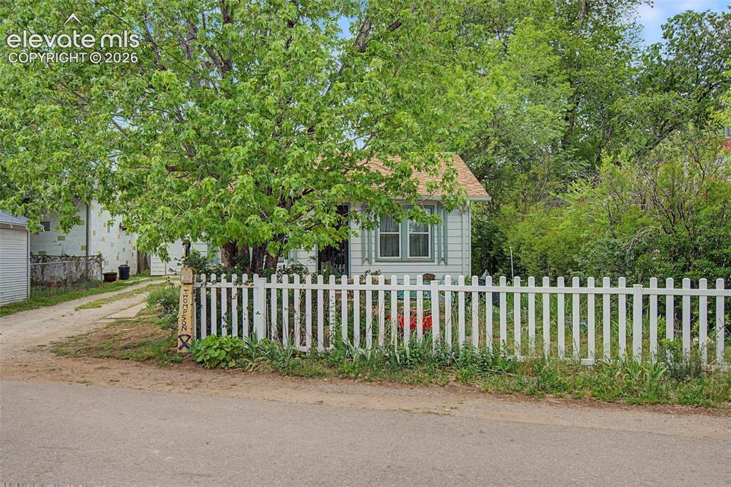 Image 3 of 26: Quaint picket fence - lovely trees 