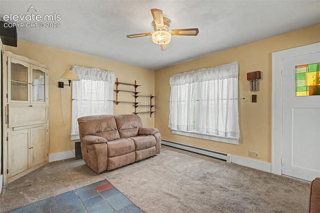 Image 6 of 26: Front entry into living room