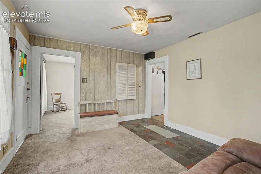 Image 8 of 26: Entry to primary bedroom from living room