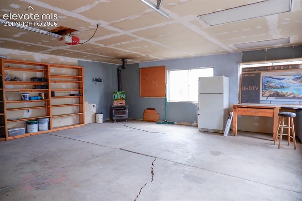 Image 36 of 38: 3 car garage interior