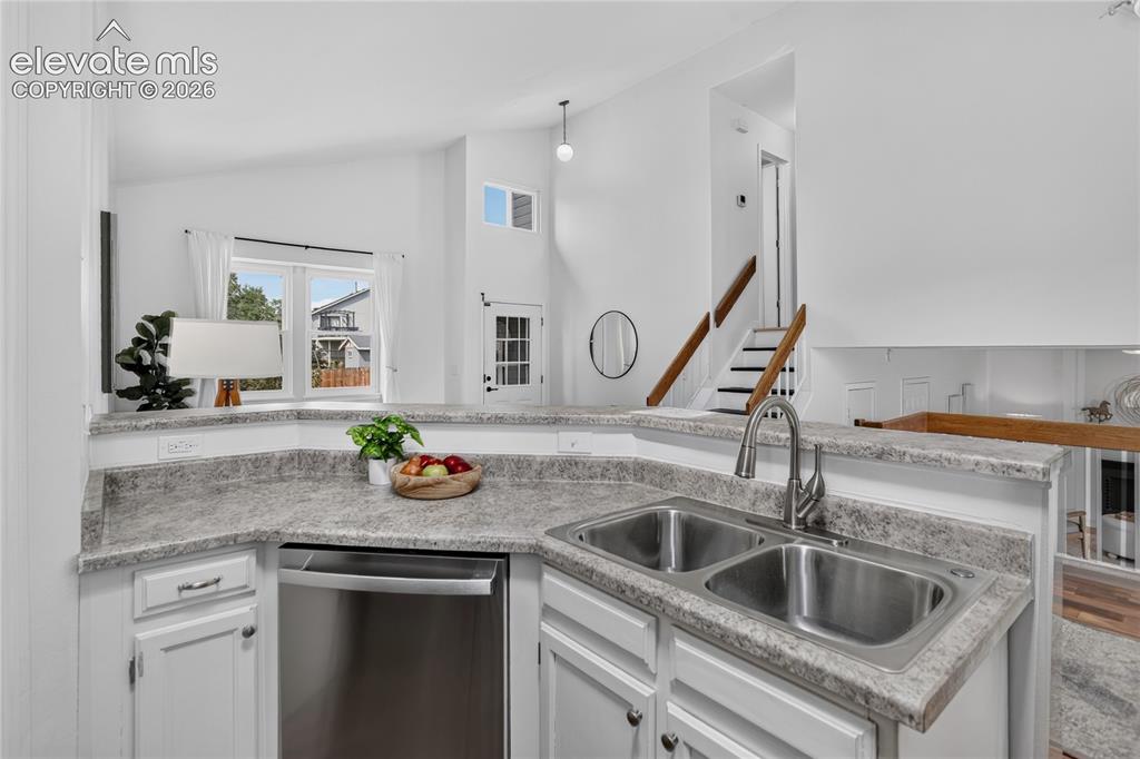 Image 7 of 25: Open concept galley kitchen