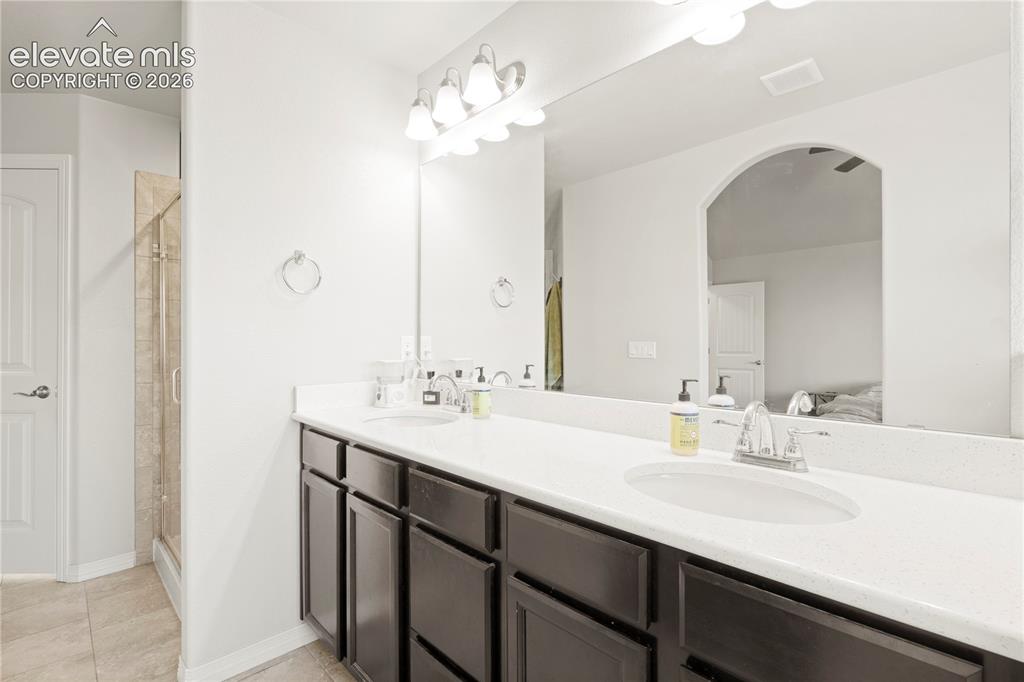 Image 13 of 48: Primary BathRoom /Bed Main Floor