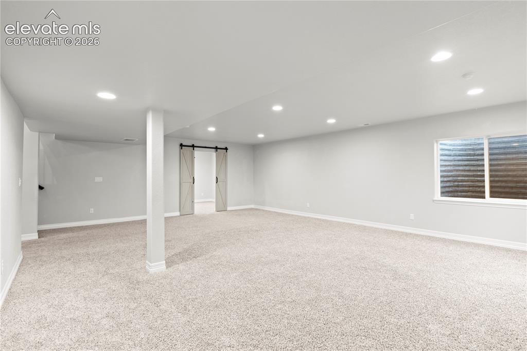 Image 21 of 48: Lower Level Living Room Basement