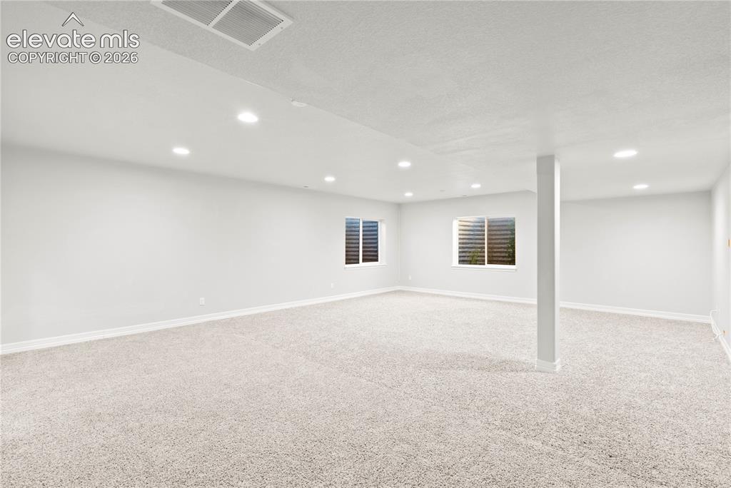 Image 25 of 48: Lower Level Living Room Basement