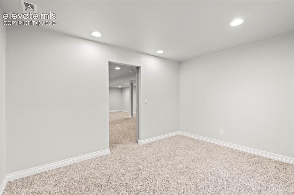 Image 28 of 48: 1st Bedroom or Office off of lower level living room
