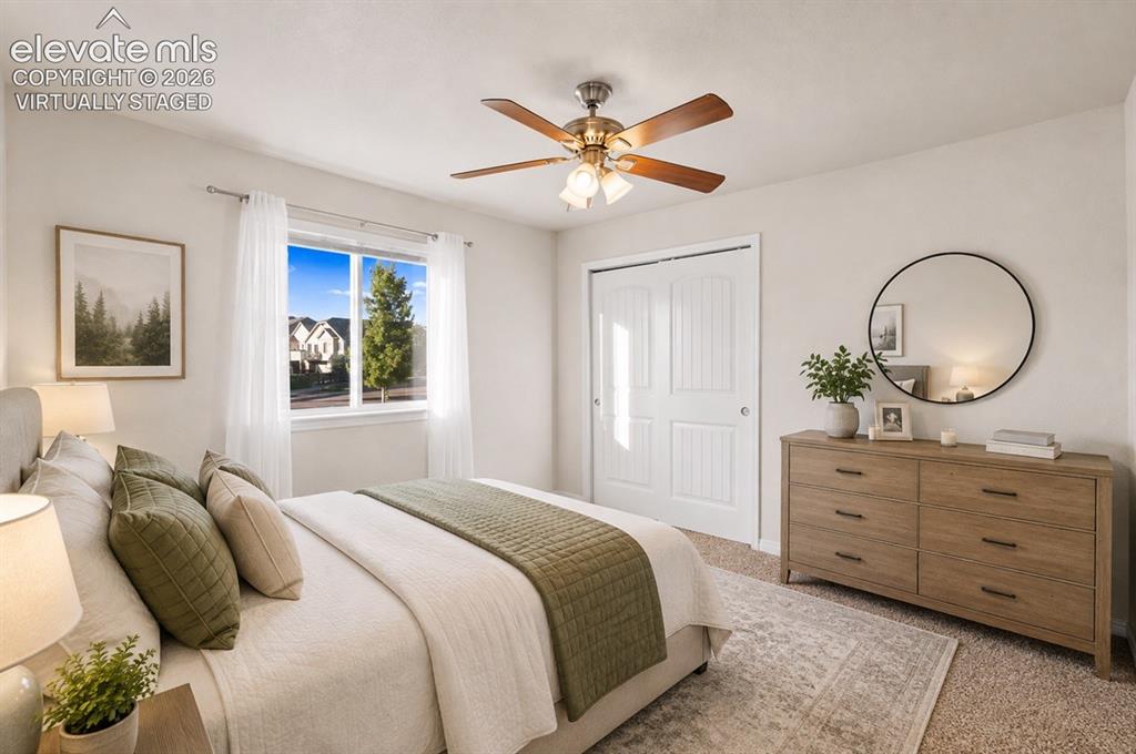 Image 43 of 48: 2nd Bedroom Main Floor freshly painted walls, a window with white sheers, a
