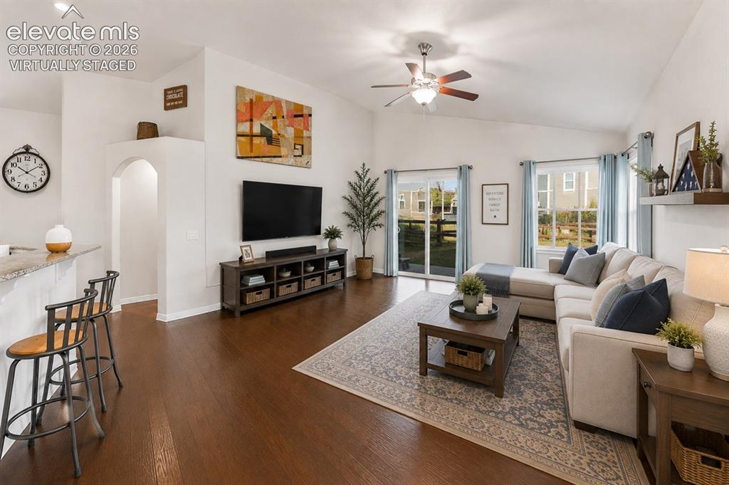 Image 47 of 48: Vaulted ceilings and wood-finish flooring enhance this living area.virtuall