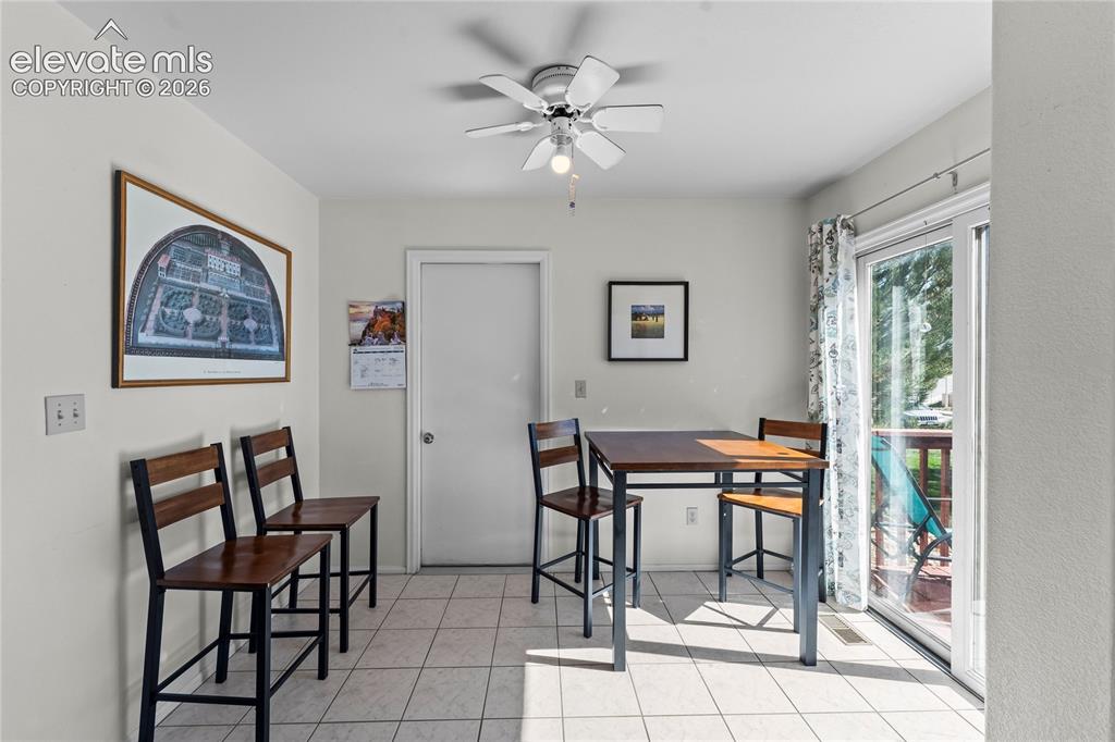 Image 8 of 43: Ceramic tile flooring, ceiling fan with integrated lighting, and white inte