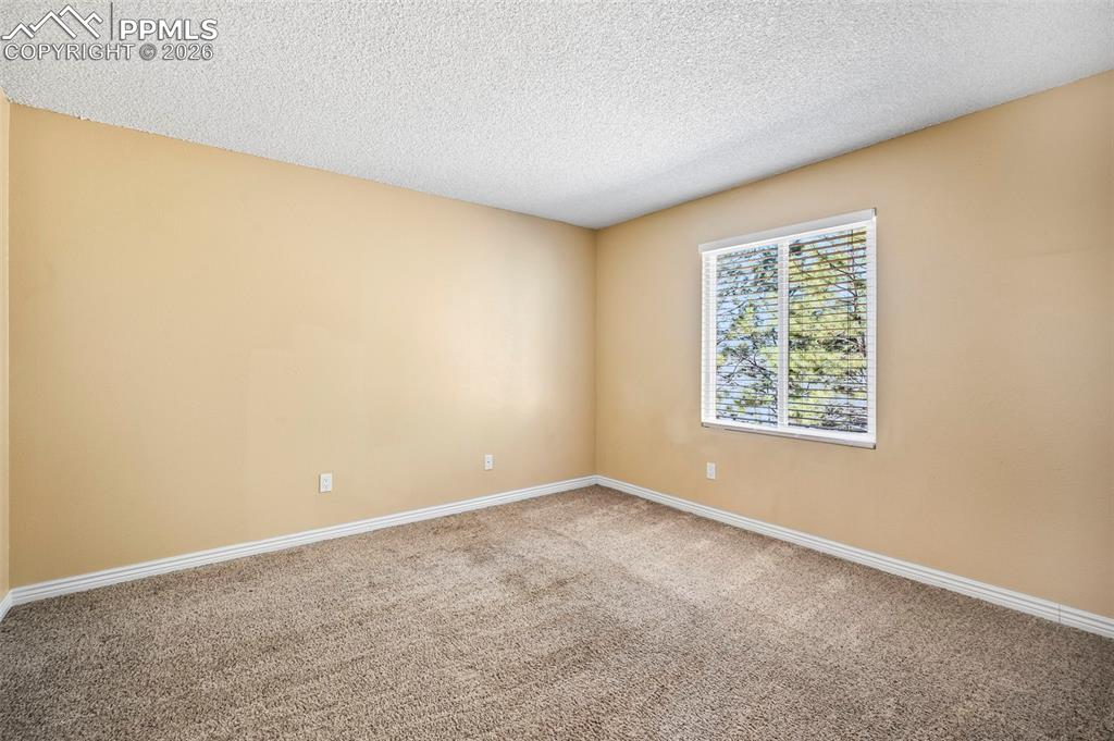 Image 21 of 39: Additional bedrooms provide refined flexibility for guests, work, or creati