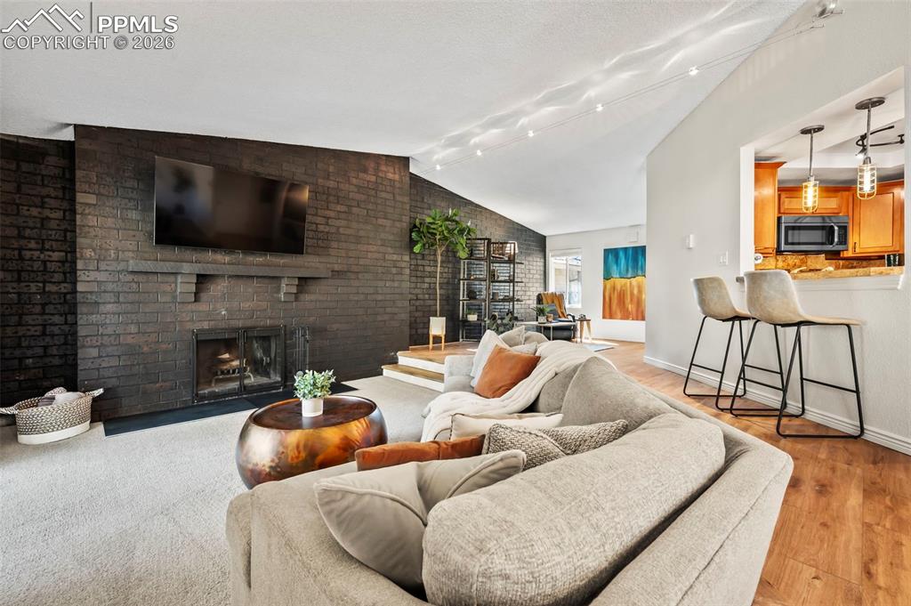 Image 8 of 39: Open sightlines maintain a sense of flow and connection throughout the livi