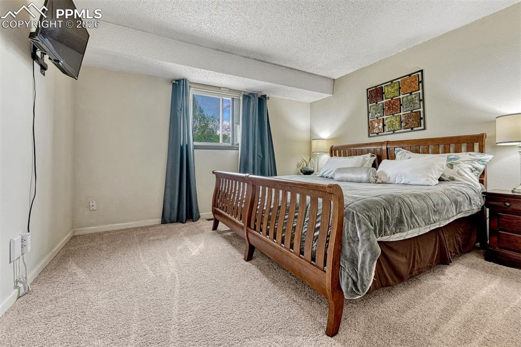 Image 14 of 42: Carpeted interior space featuring a window with natural light, recessed cei