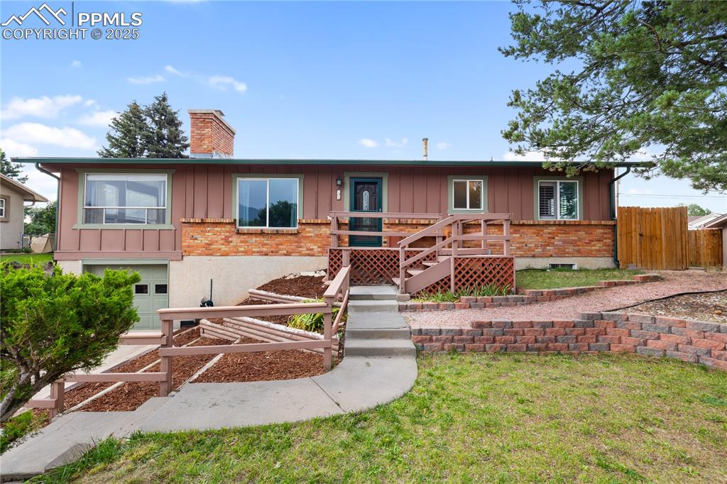 Caption: Charming raised ranch curb appeal