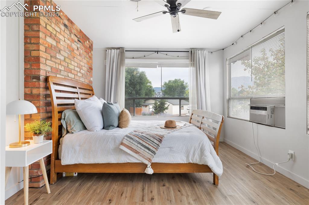Image 16 of 35: Sunny bedroom with LVP floors