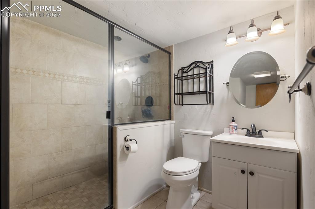 Image 28 of 35: Basement bathroom with walk-in shower