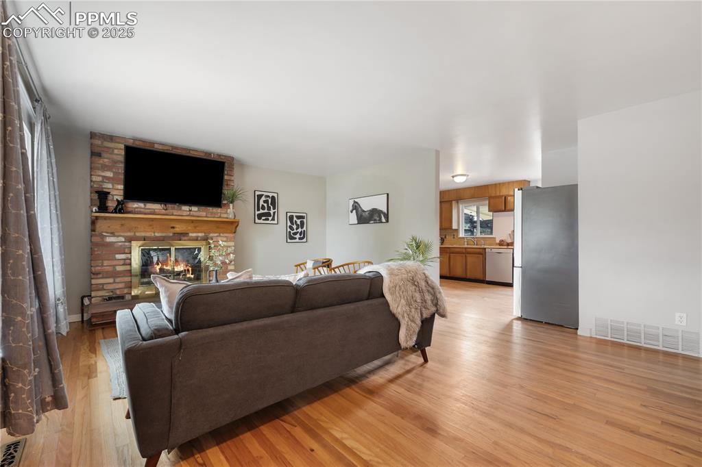 Image 6 of 35: Cozy fireplace and mountain views